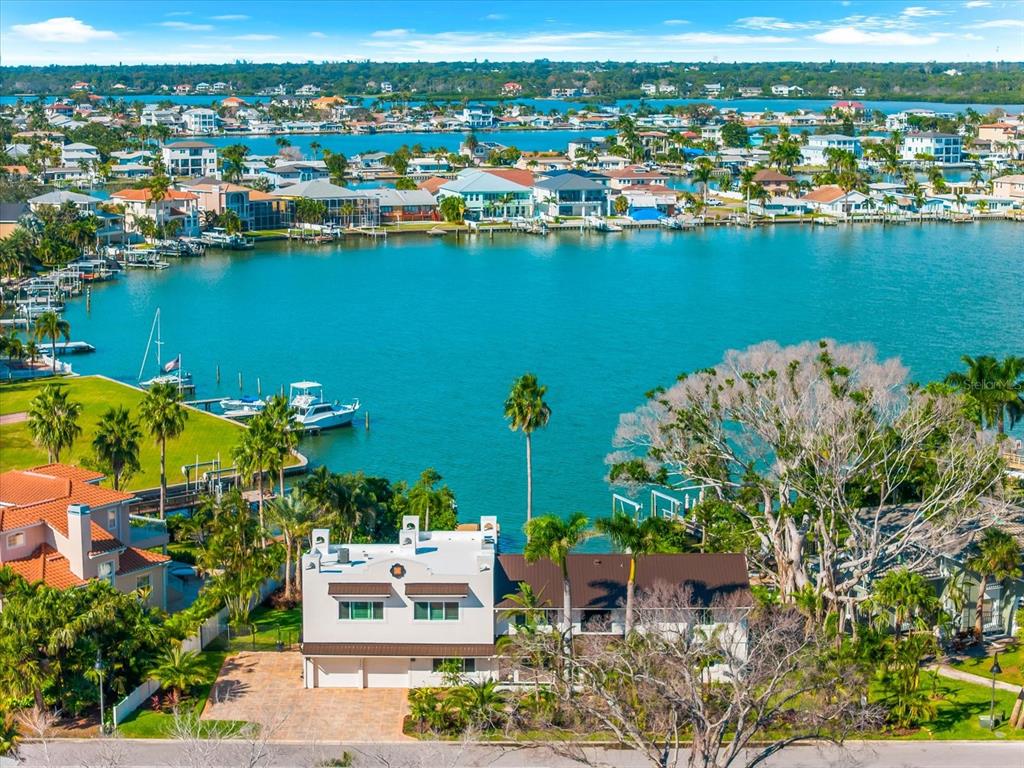 an aerial view of a houses with a lake view