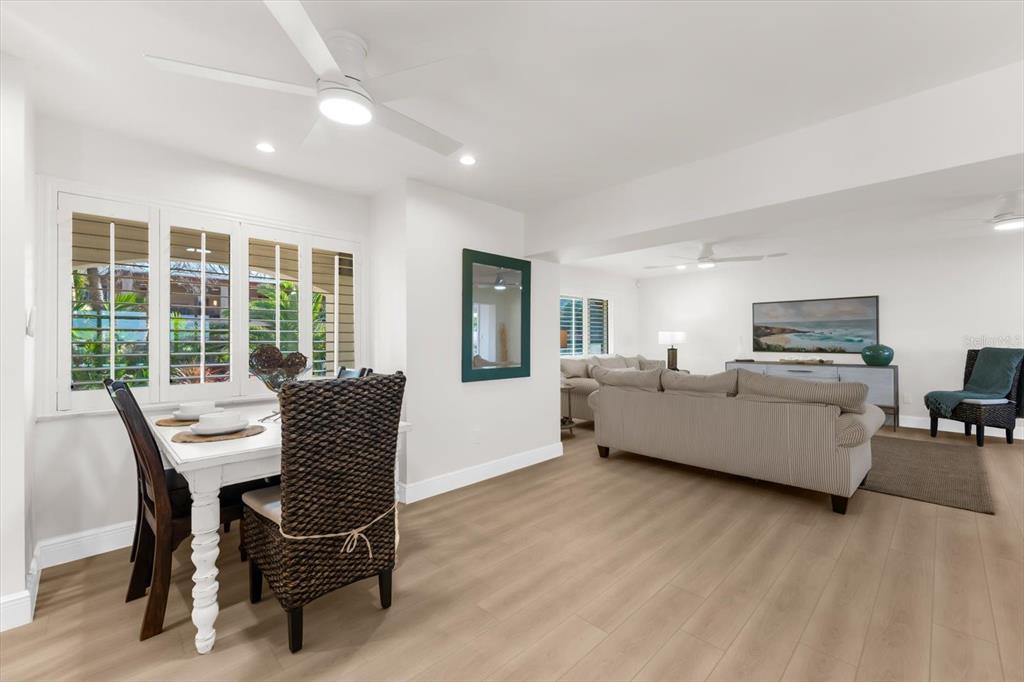 16895 1st Street East North Redington Beach, FL 33708 - Photo 14 of 97 a living room with furniture and a large window