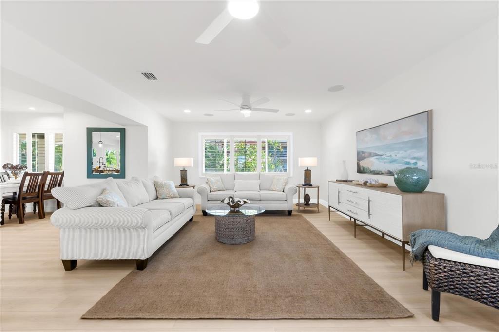 16895 1st Street East North Redington Beach, FL 33708 - Photo 15 of 97 a living room with furniture and a window