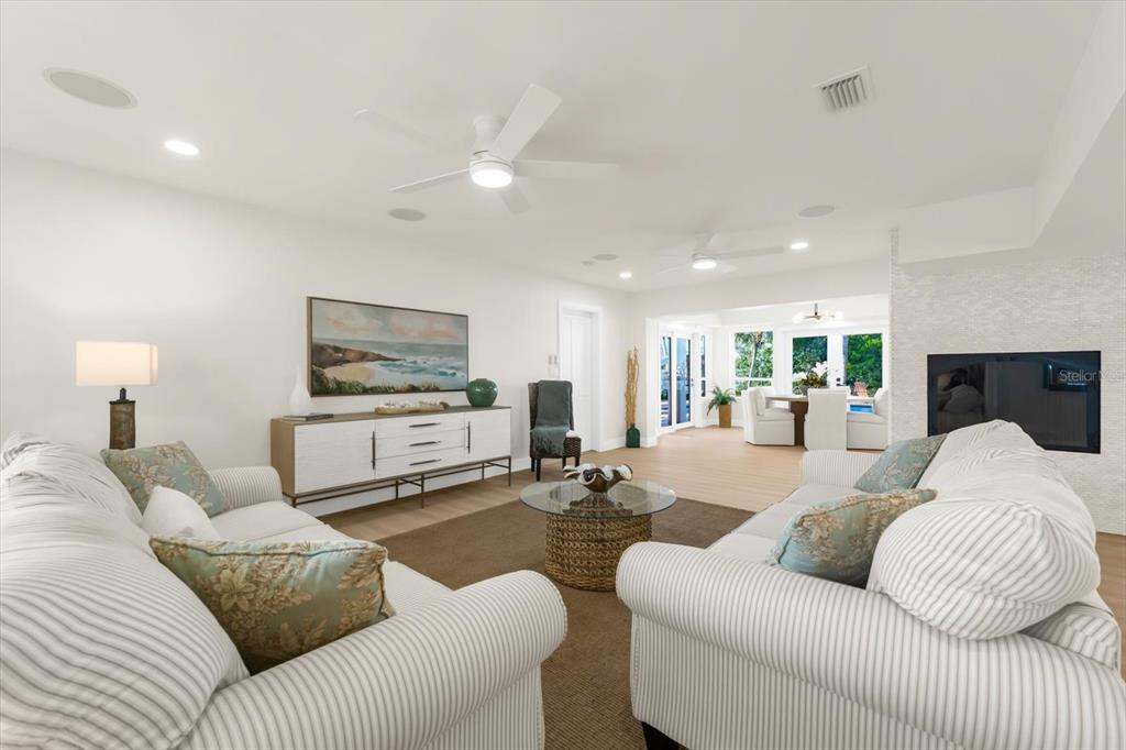 16895 1st Street East North Redington Beach, FL 33708 - Photo 19 of 96 a living room with furniture and a flat screen tv