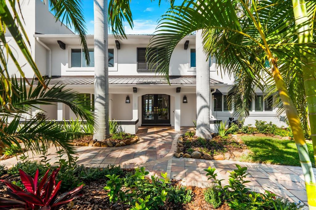 16895 1st Street East North Redington Beach, FL 33708 - Photo 2 of 97 a front view of a house with a yard