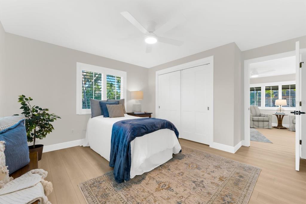 16895 1st Street East North Redington Beach, FL 33708 - Photo 22 of 97 a spacious bedroom with a bed and a couch