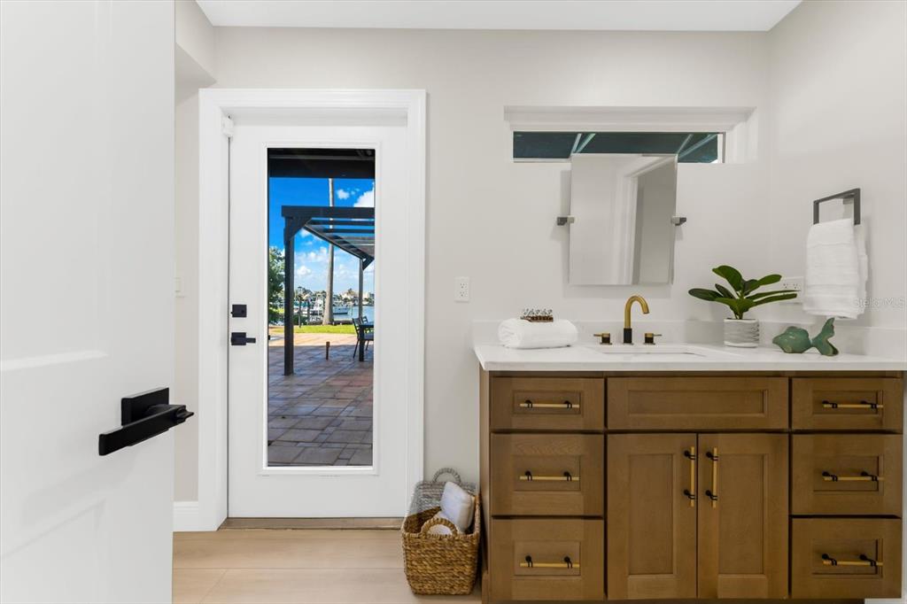 16895 1st Street East North Redington Beach, FL 33708 - Photo 25 of 97 a bathroom with a sink and a mirror