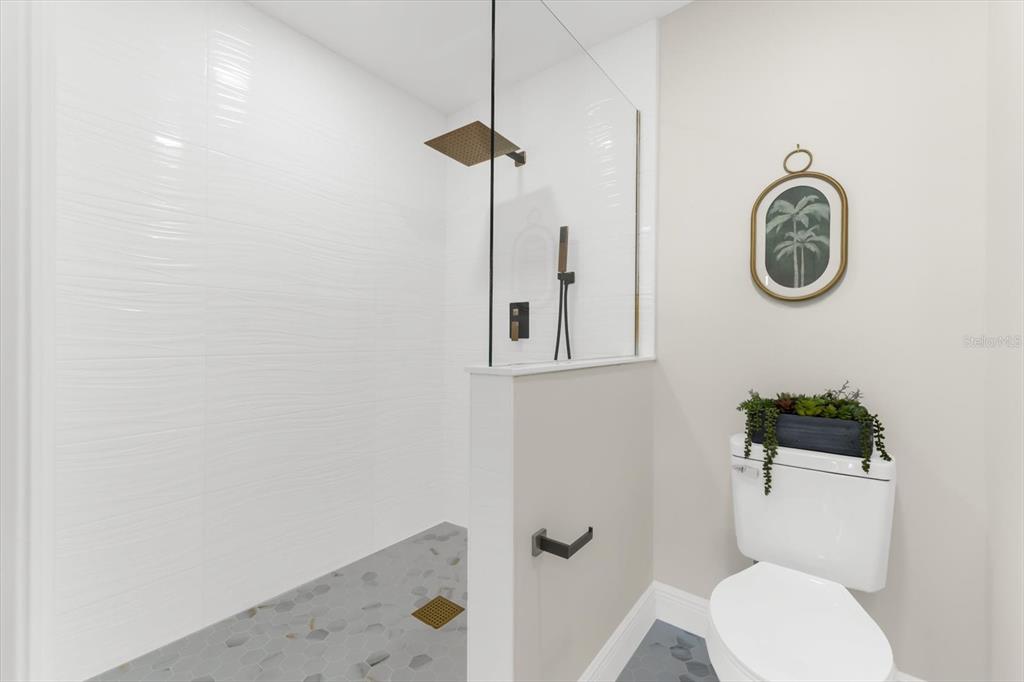 16895 1st Street East North Redington Beach, FL 33708 - Photo 26 of 97 a bathroom with a toilet and a shower