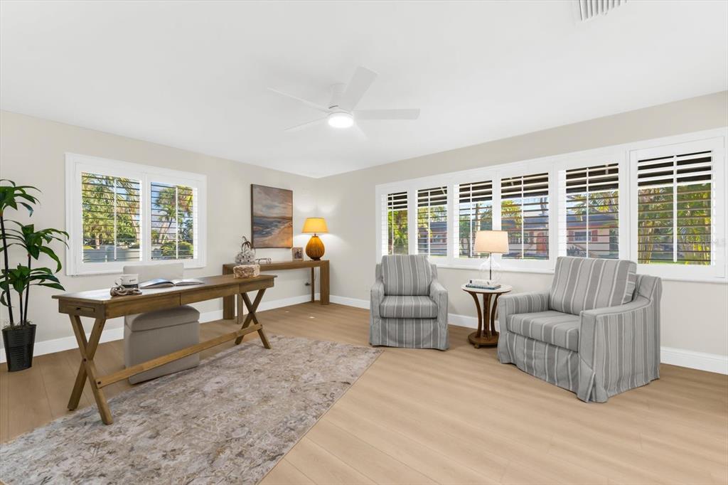 16895 1st Street East North Redington Beach, FL 33708 - Photo 28 of 97 a living room with furniture and a large window