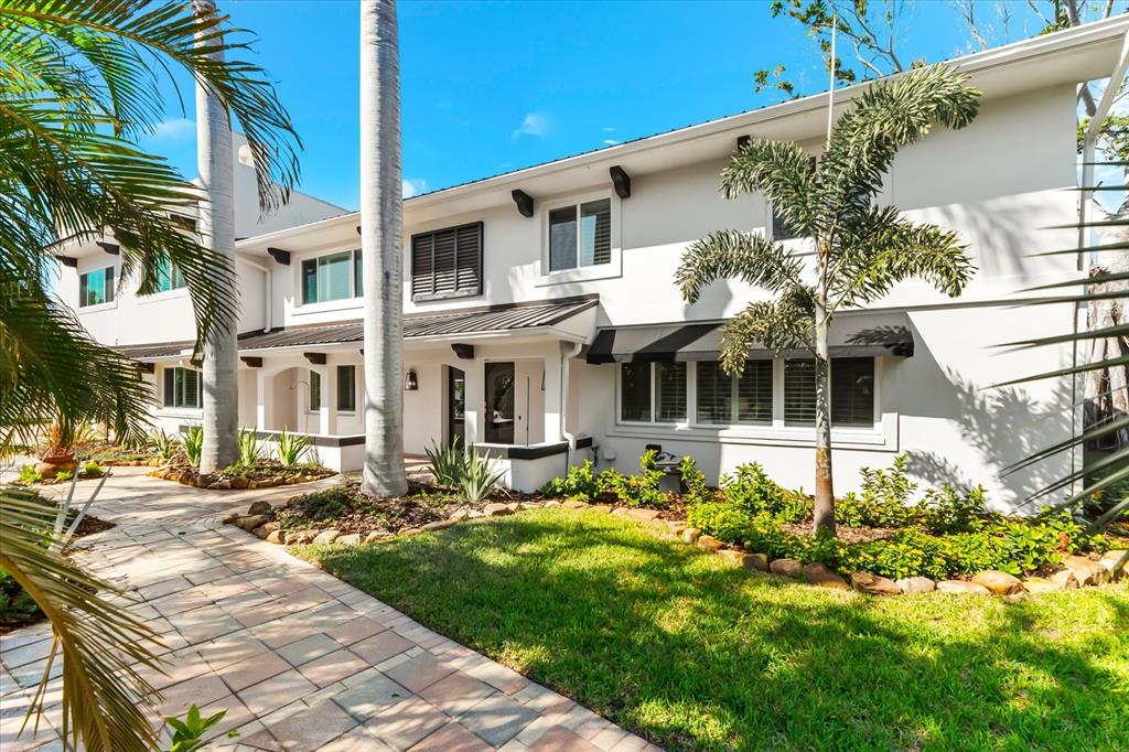 16895 1st Street East North Redington Beach, FL 33708 - Photo 4 of 96 a front view of a house with a yard