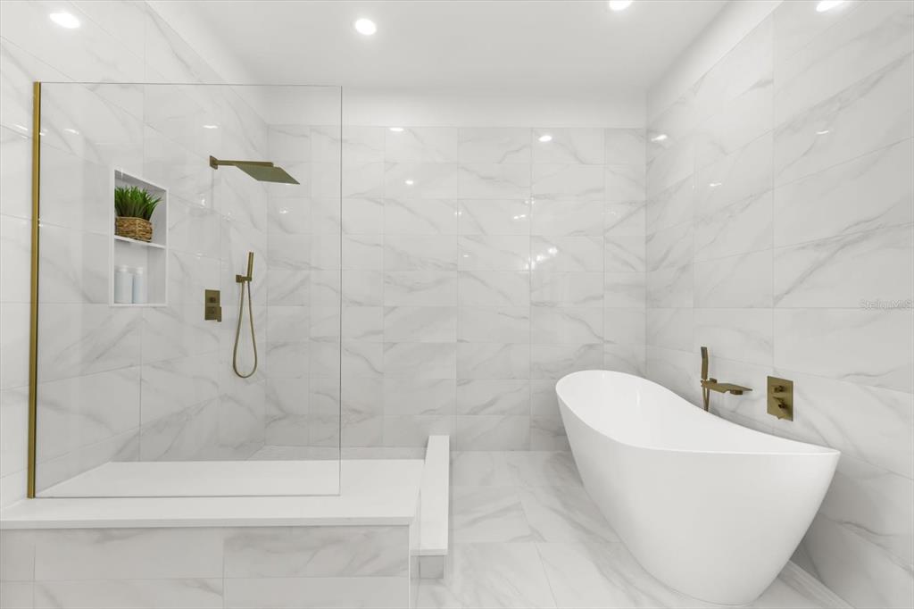 16895 1st Street East North Redington Beach, FL 33708 - Photo 47 of 97 a bathroom with a bathtub and shower