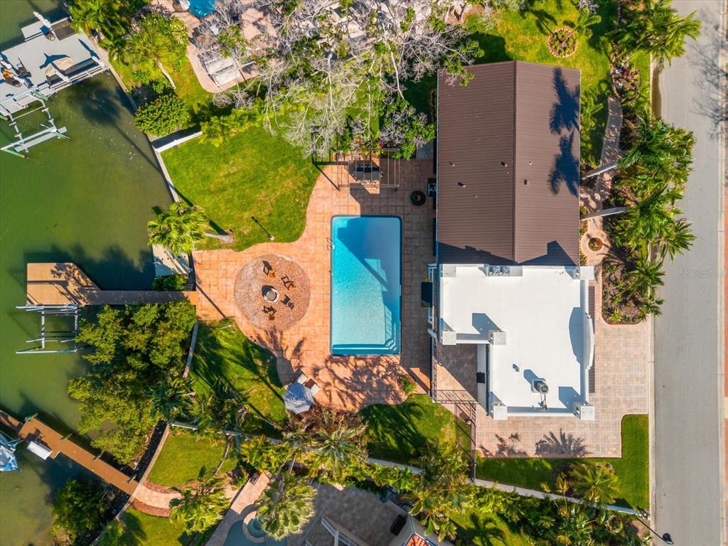 16895 1st Street East North Redington Beach, FL 33708 - Photo 78 of 97 an aerial view of a house with a yard and trees