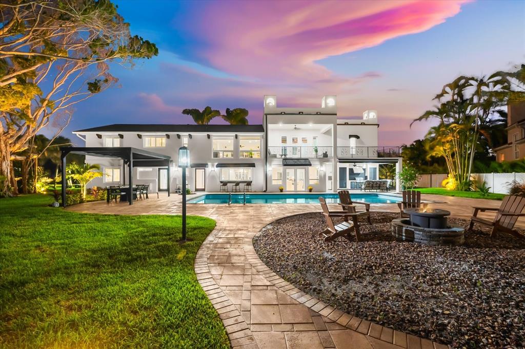 16895 1st Street East North Redington Beach, FL 33708 - Photo 86 of 97 a swimming pool with outdoor seating and yard