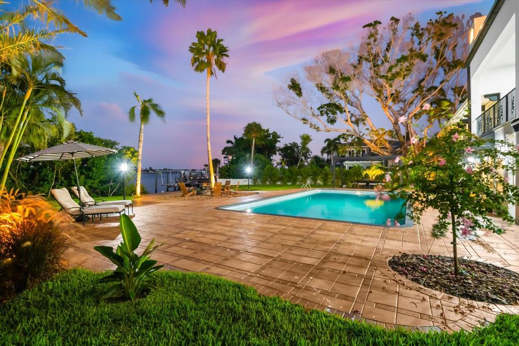 16895 1st Street East North Redington Beach, FL 33708 - Photo 92 of 97 a view of a fountain in front of a house with a big yard