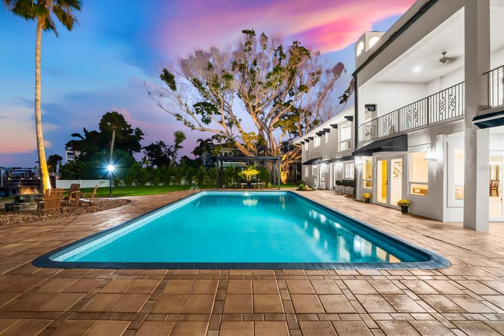 16895 1st Street East North Redington Beach, FL 33708 - Photo 93 of 97 a view of swimming pool with outdoor seating