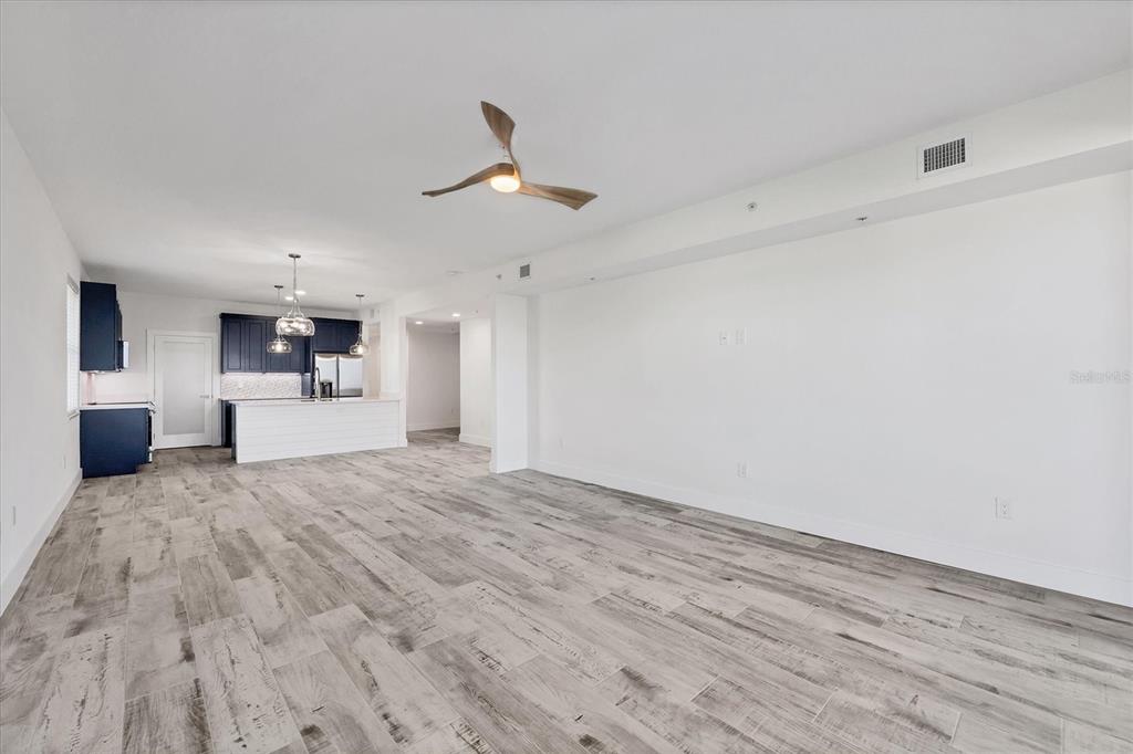 9203 Griggs Road, Unit A204 Englewood, FL 34224 - Photo 11 of 54 a view of a kitchen with a sink and a refrigerator