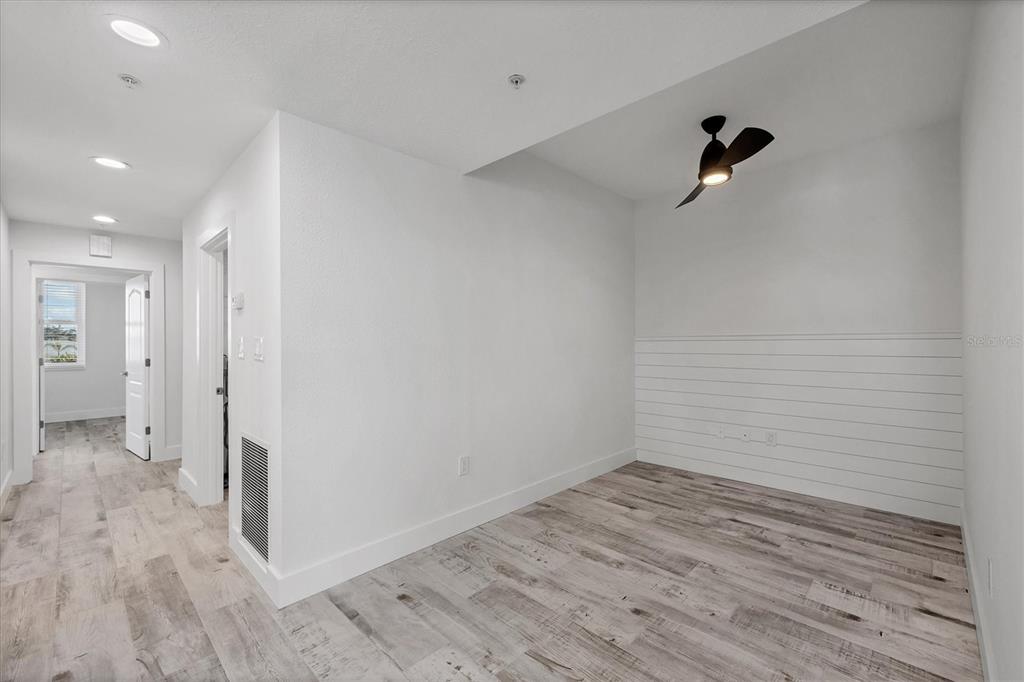 9203 Griggs Road, Unit A204 Englewood, FL 34224 - Photo 18 of 54 a view of a room with wooden floor and bathroom