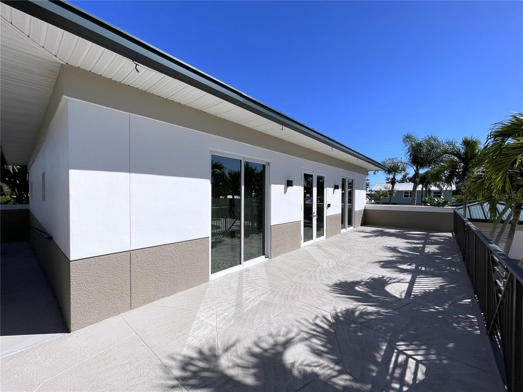 9203 Griggs Road, Unit A204 Englewood, FL 34224 - Photo 40 of 54 a view of a house with a snow in the yard