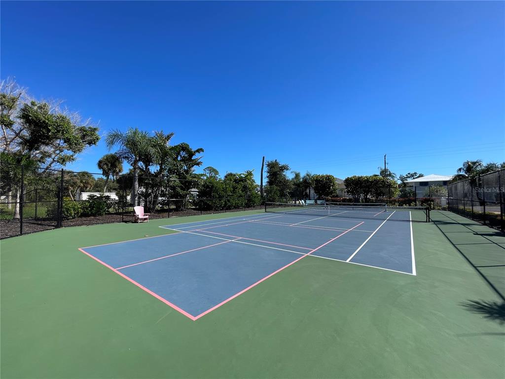 9203 Griggs Road, Unit A204 Englewood, FL 34224 - Photo 43 of 54 a view of tennis court