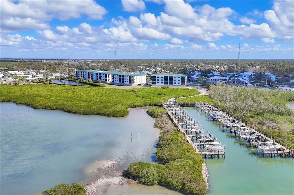 9203 Griggs Road, Unit A204 Englewood, FL 34224 - Photo 47 of 54 a view of a city with a lake