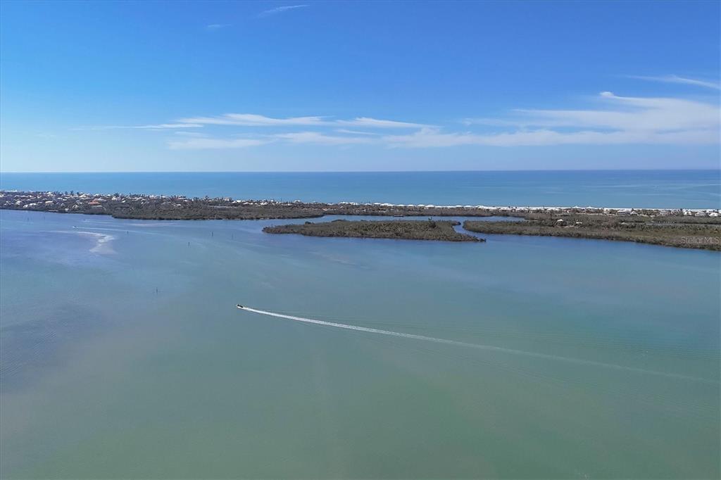 9203 Griggs Road, Unit A204 Englewood, FL 34224 - Photo 48 of 54 a view of an ocean and city
