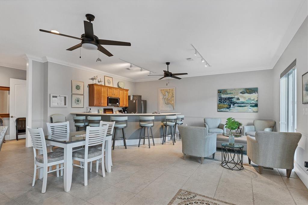 9203 Griggs Road, Unit A204 Englewood, FL 34224 - Photo 50 of 54 a view of a dining room with furniture and a window