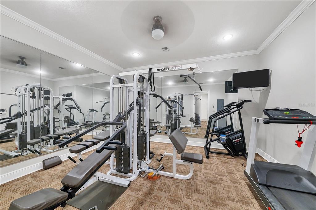 9203 Griggs Road, Unit A204 Englewood, FL 34224 - Photo 52 of 54 a view of a room with gym equipment