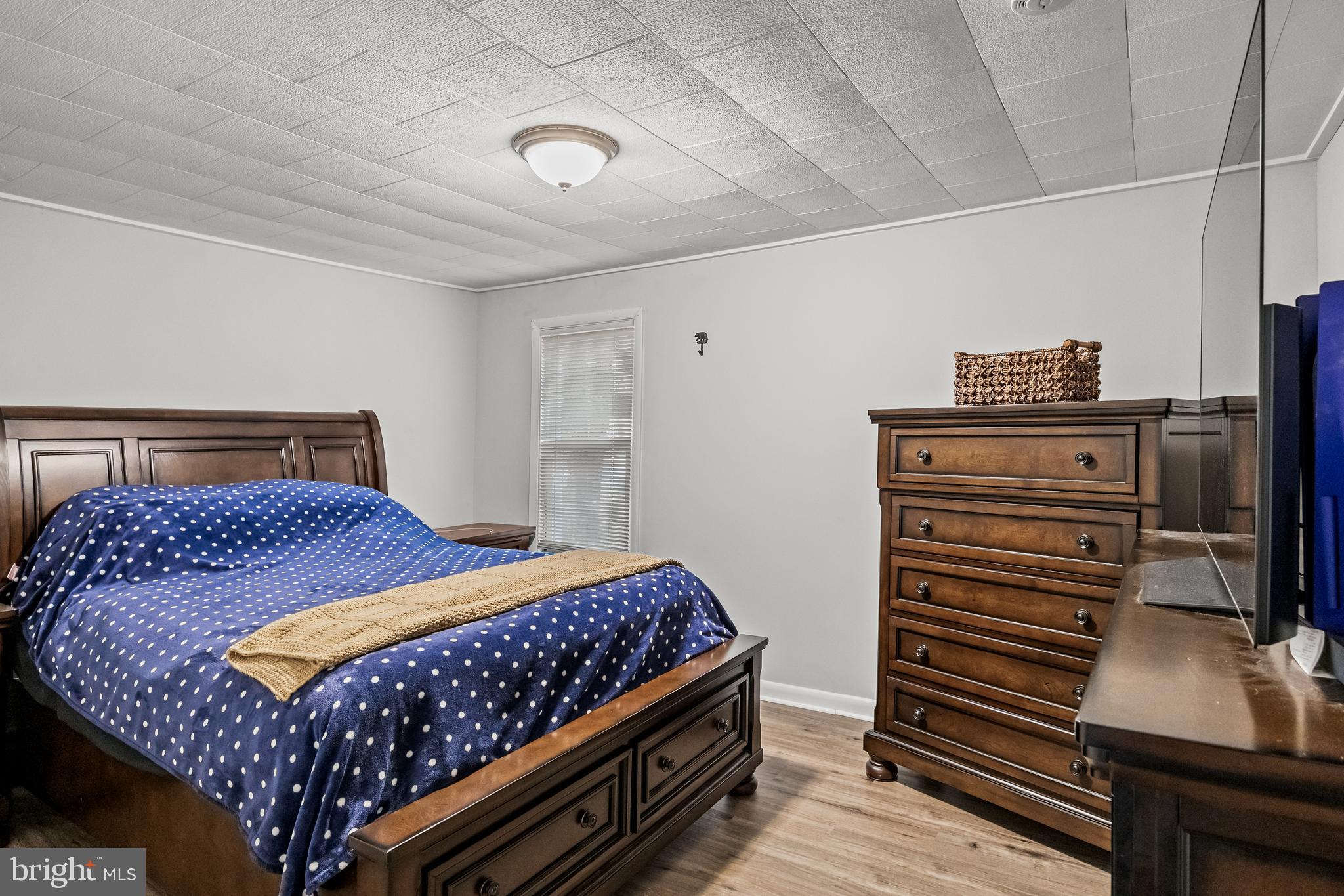 450 South 1st Road Hammonton, NJ 08037 - Photo 17 of 28 a bedroom with a bed and dresser