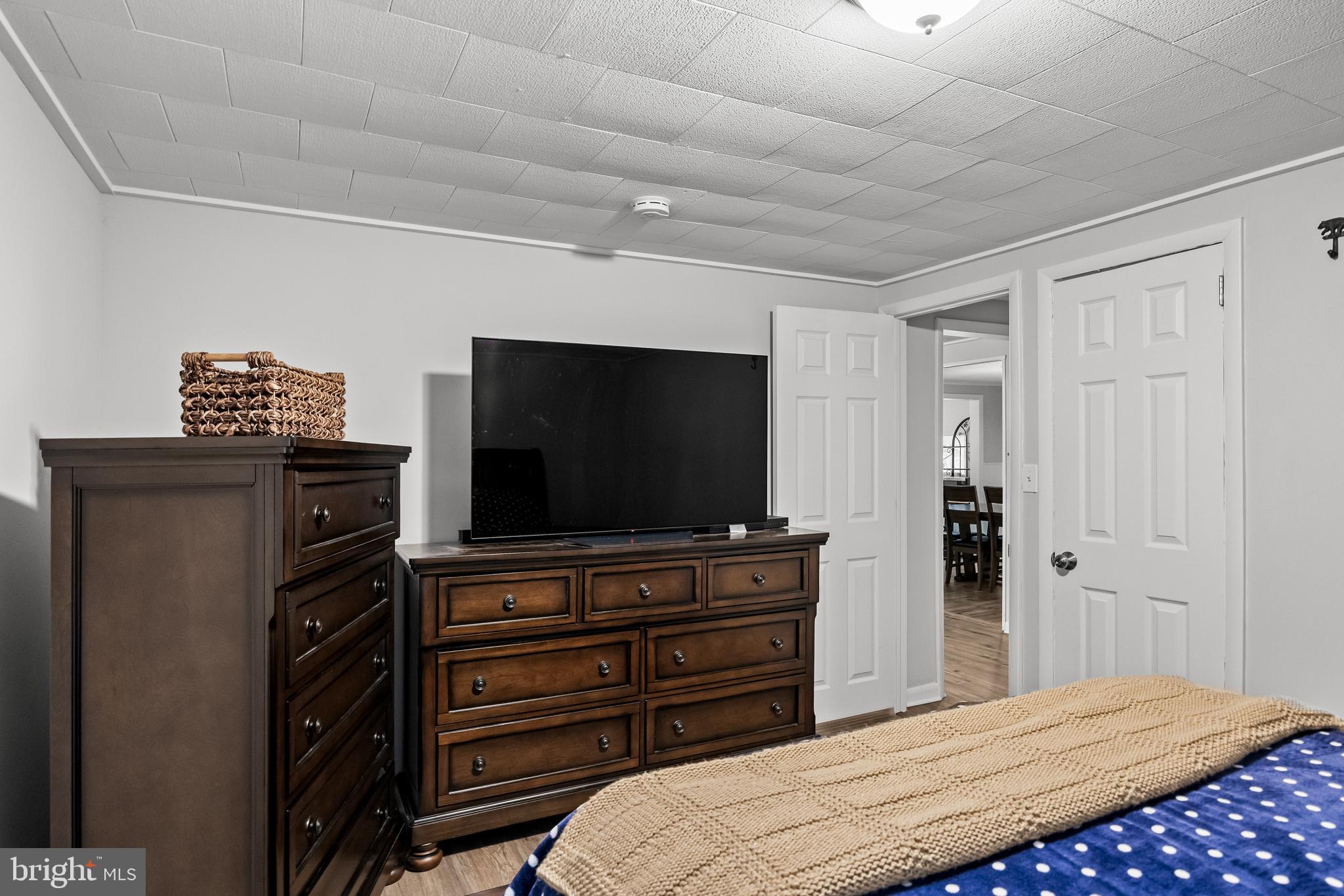 450 South 1st Road Hammonton, NJ 08037 - Photo 18 of 28 a bedroom with a bed and a flat screen tv