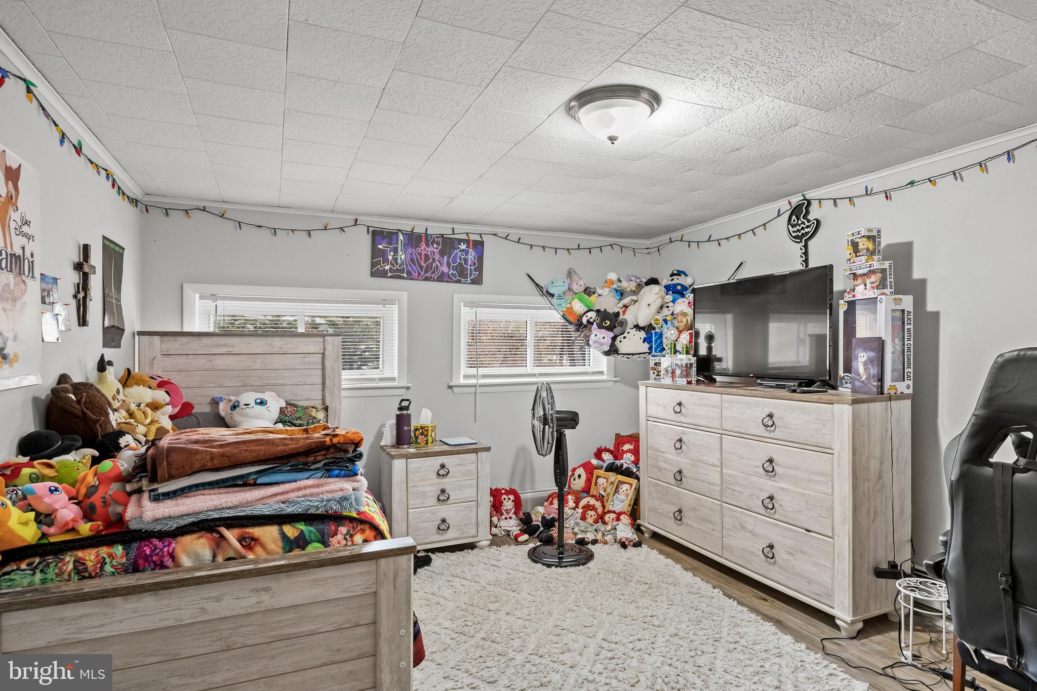 450 South 1st Road Hammonton, NJ 08037 - Photo 20 of 28 a bedroom with furniture and a flat screen tv