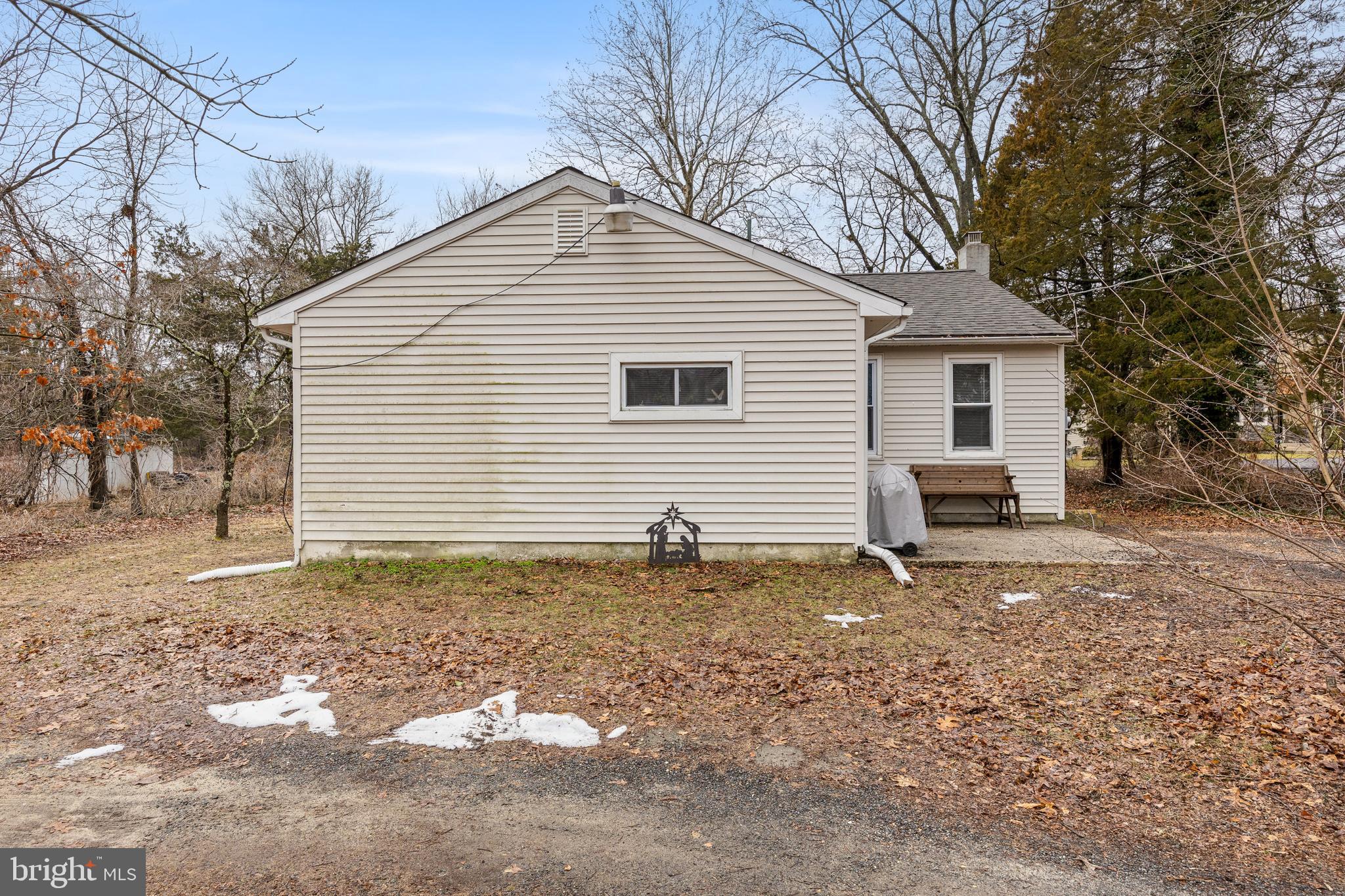 450 South 1st Road Hammonton, NJ 08037 - Photo 3 of 28 a house covered with trees in the background