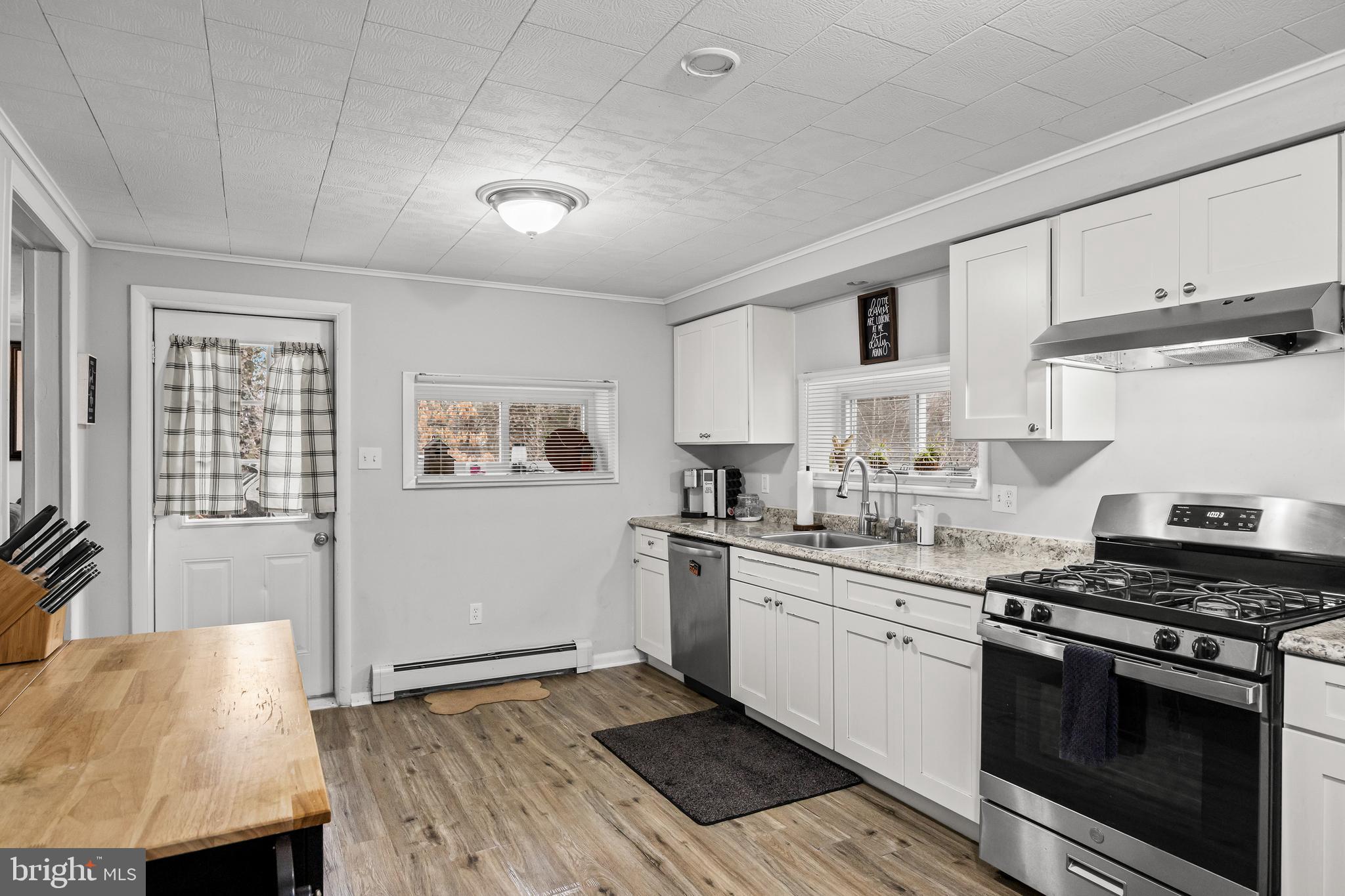 450 South 1st Road Hammonton, NJ 08037 - Photo 8 of 28 a kitchen with stainless steel appliances granite countertop a stove and a refrigerator