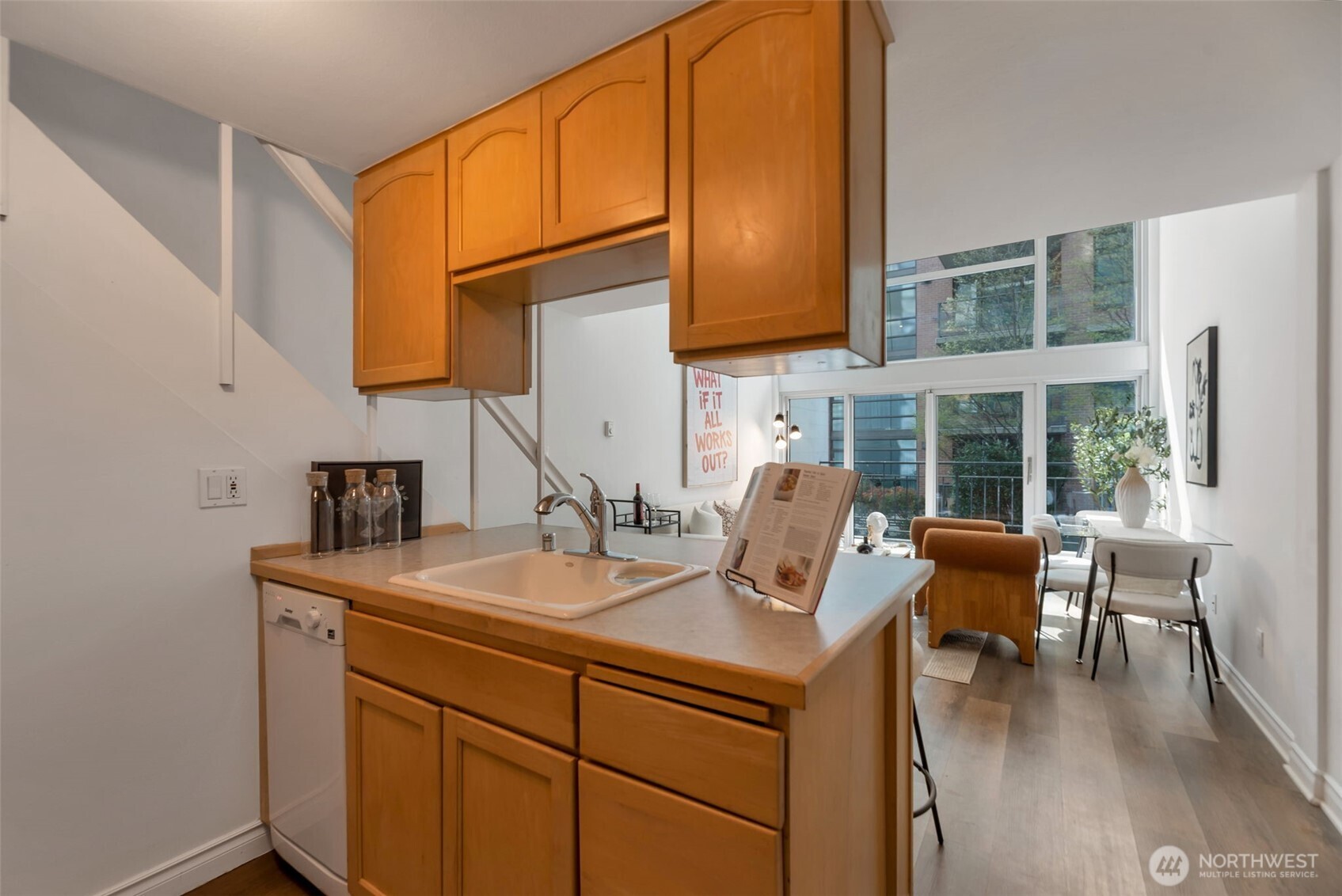 1000 Union Street, Unit 110 Seattle, WA 98101 - Photo 11 of 16 a view of a kitchen with furniture and wooden floor