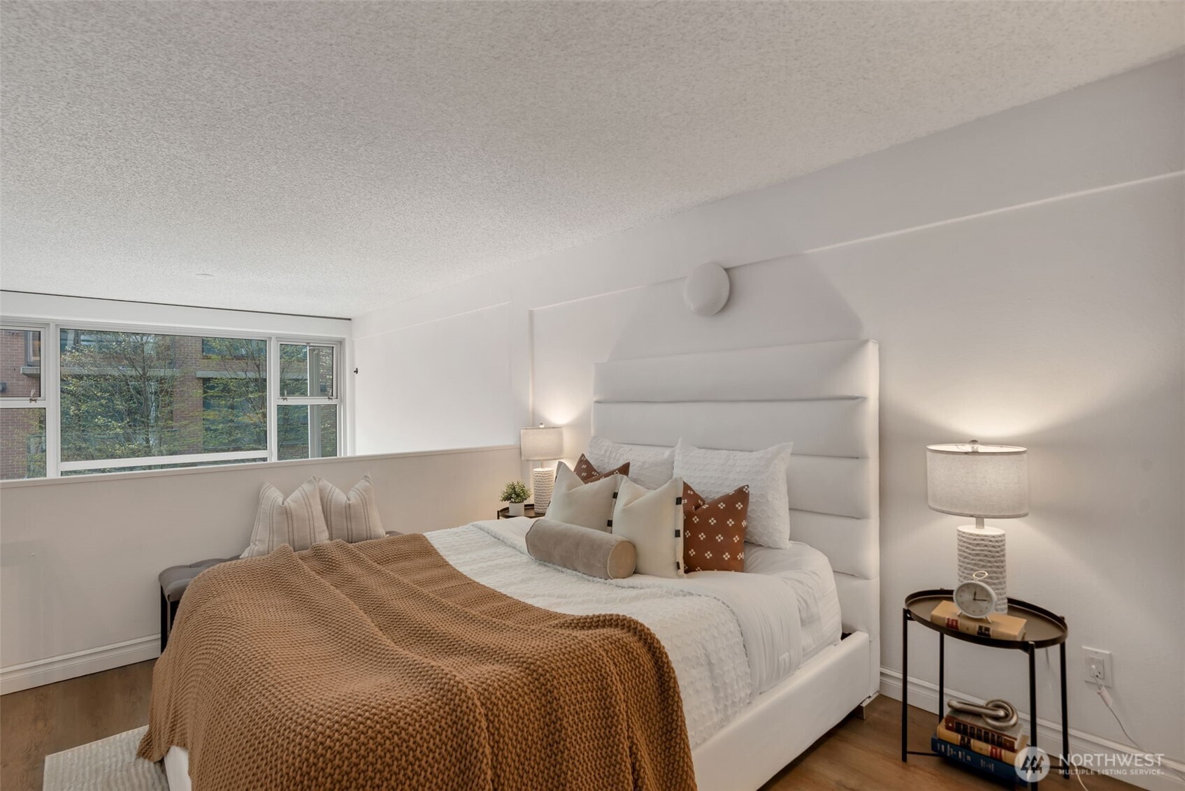 1000 Union Street, Unit 110 Seattle, WA 98101 - Photo 13 of 16 a bedroom with a bed and window