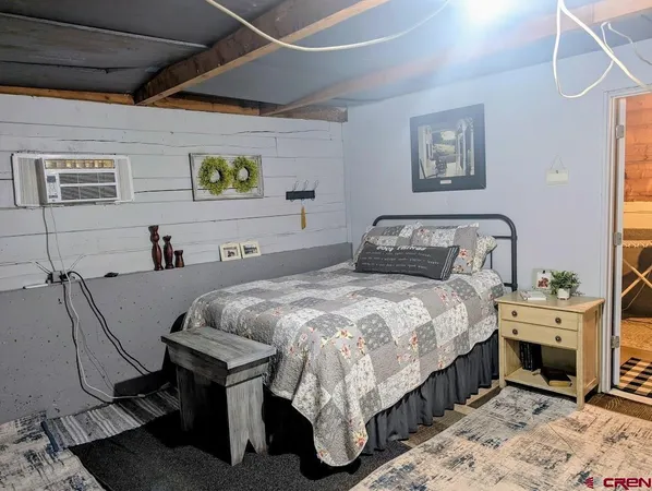a bedroom with a bed and a table