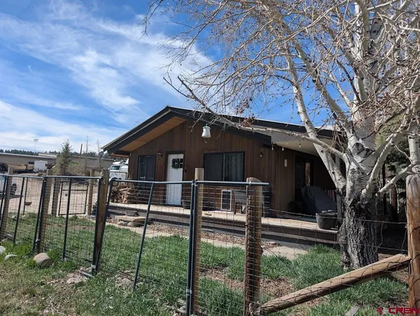 a house view with a backyard space