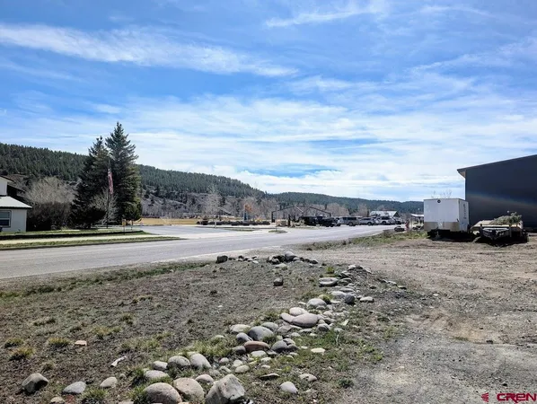 a view of a road with an ocean