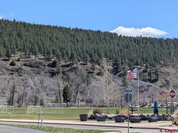 a view of a town with large trees