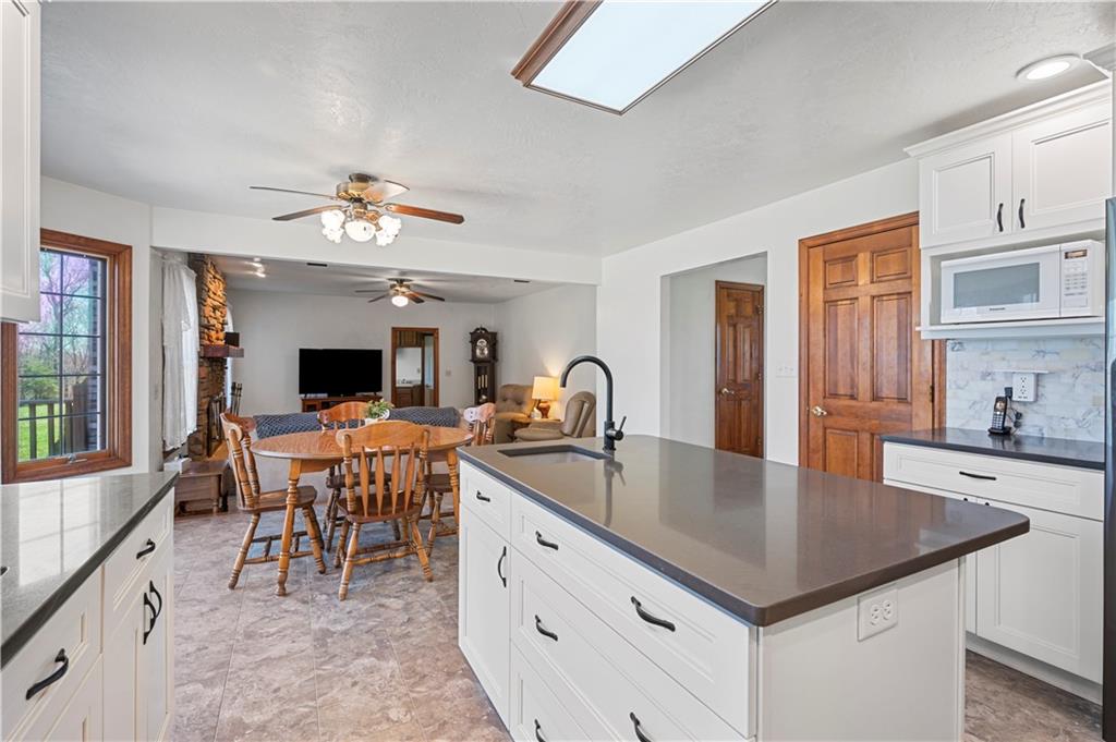 322 Cole Road Sarver, PA 16055 - Photo 7 of 49 a kitchen with a table chairs and microwave
