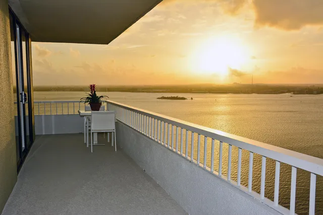 a view of a balcony with ocean view