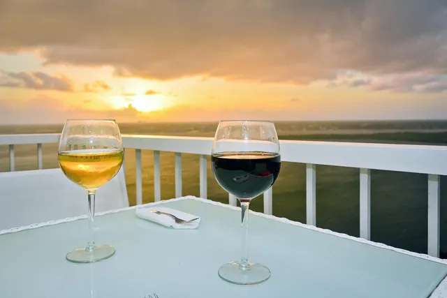 a view of a house with a table and chairs