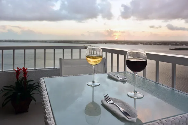 a roof deck with table and chairs