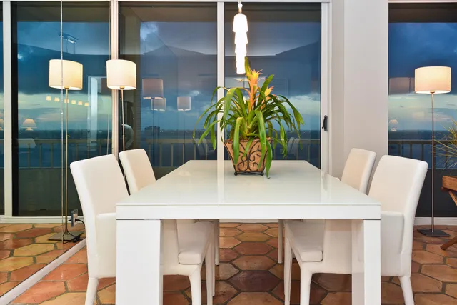a dining room with furniture and wooden floor
