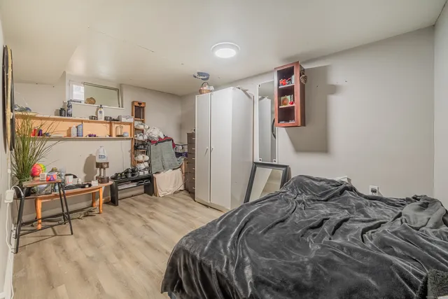 a bedroom with a bed and a cabinets