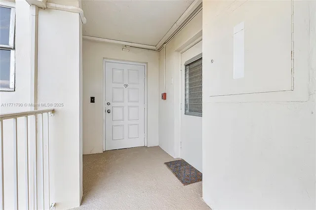 a view of a closet area with an empty room