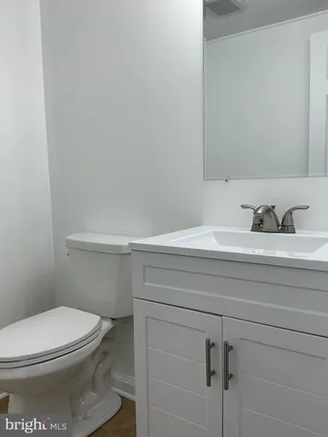 a bathroom with a toilet and a sink