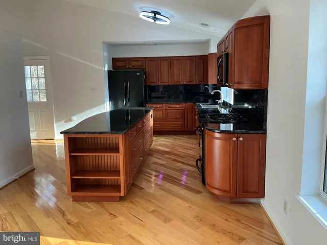 a kitchen with sink and cabinets