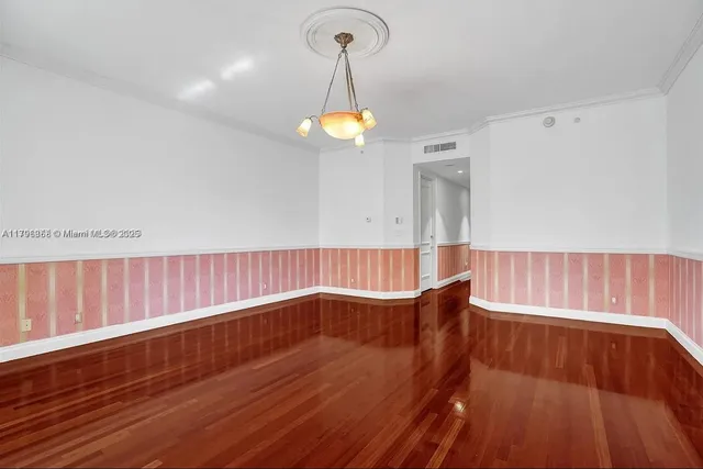 a view of a balcony and mountain with couple of potted plants