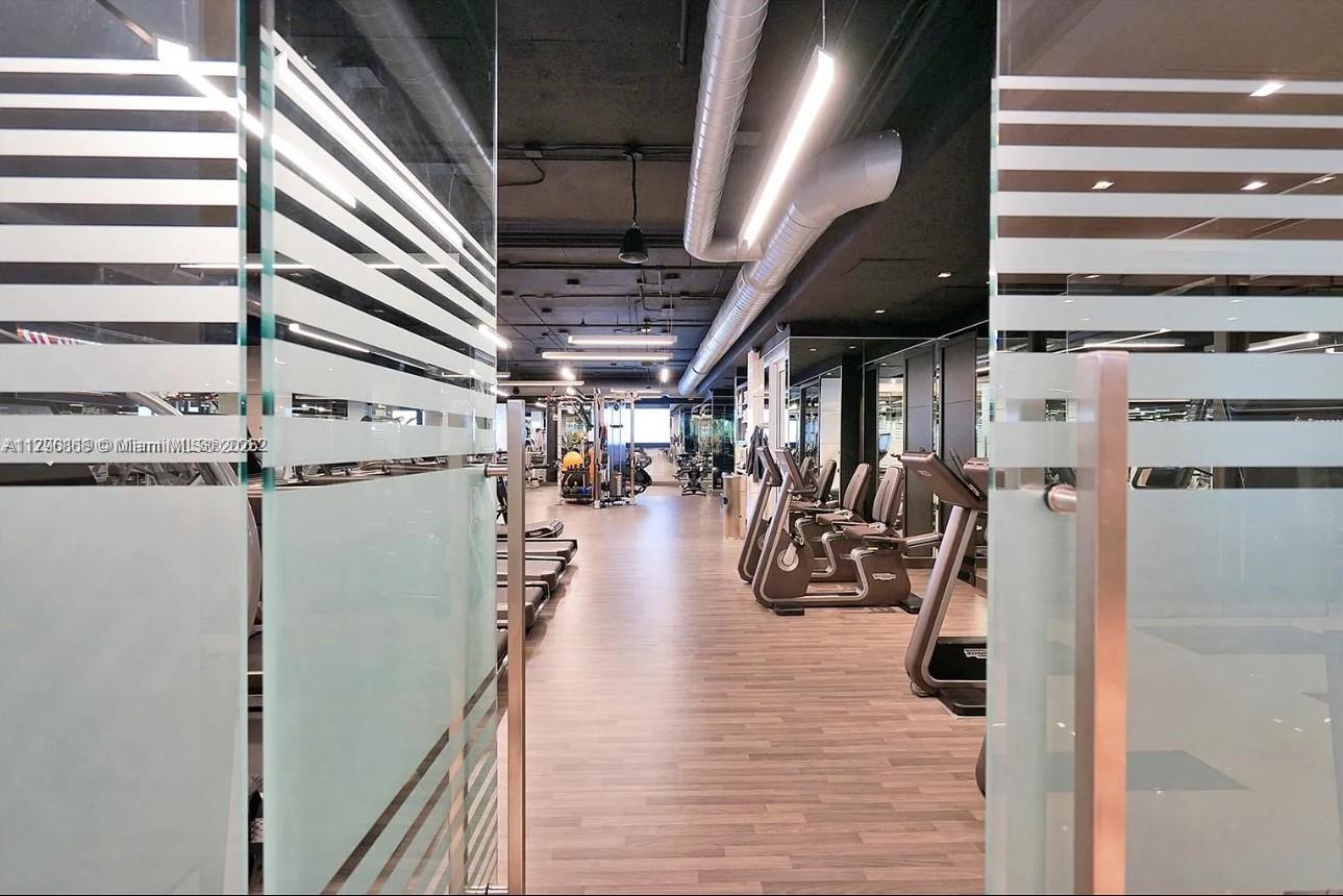 20165 Northeast 39th Place, Unit 403 Aventura, FL 33180 - Photo 31 of 40 a view of a room with gym equipment