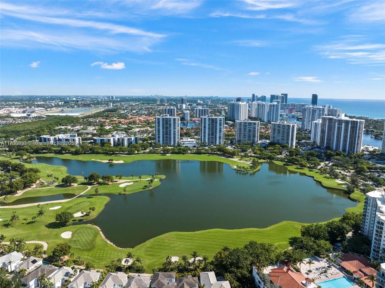 20165 Northeast 39th Place, Unit 403 Aventura, FL 33180 - Photo 36 of 40 a view of a city with a lake