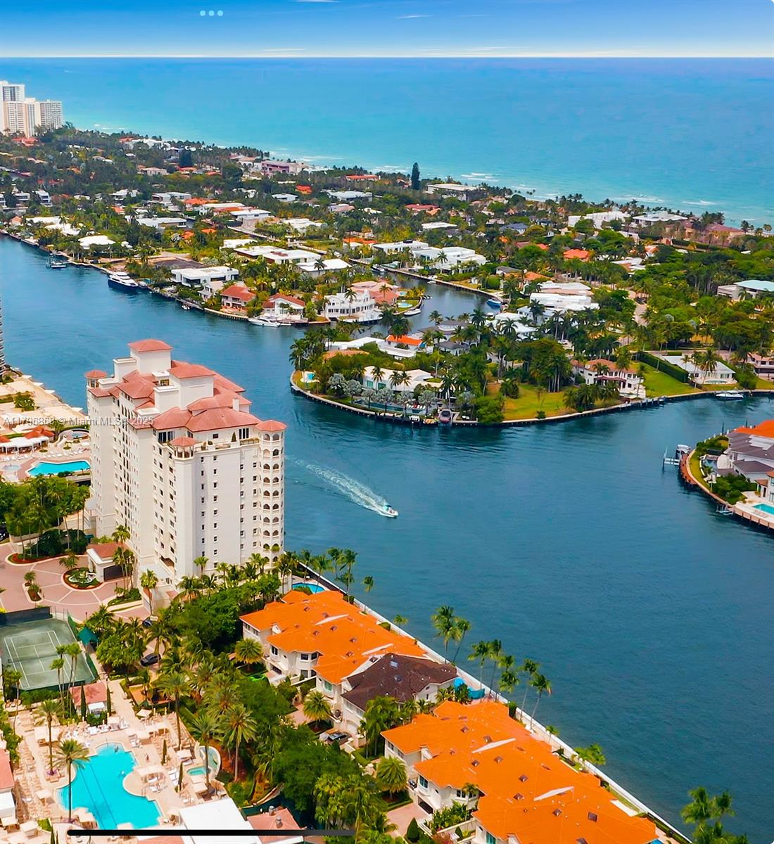20165 Northeast 39th Place, Unit 403 Aventura, FL 33180 - Photo 4 of 40 an aerial view of residential houses with outdoor space and lake view