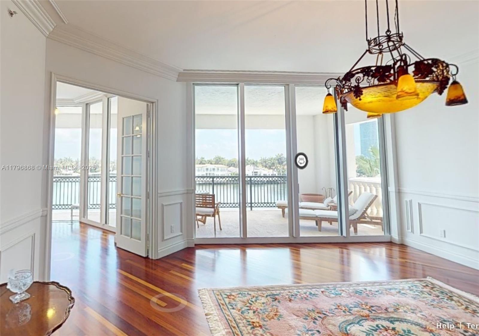 20165 Northeast 39th Place, Unit 403 Aventura, FL 33180 - Photo 8 of 40 a living room with wooden floor and floor to ceiling window