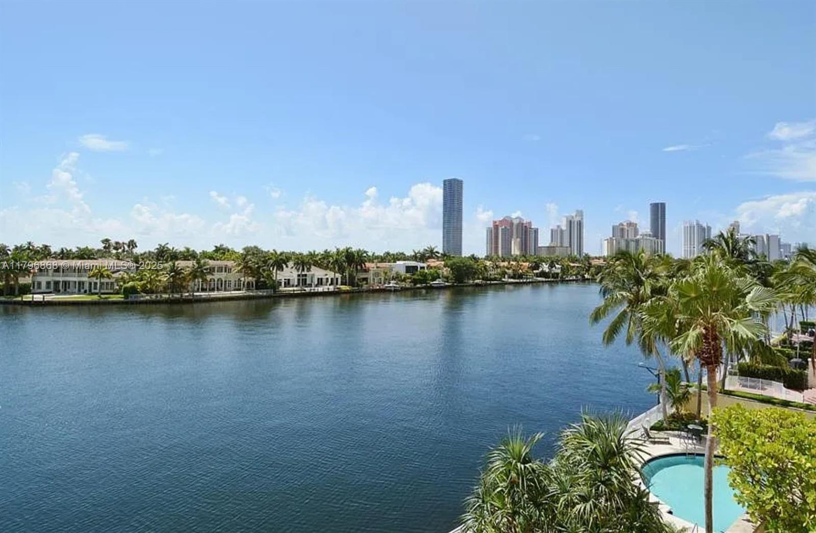 20165 Northeast 39th Place, Unit 403 Aventura, FL 33180 - Photo 9 of 40 a view of a city with a lake