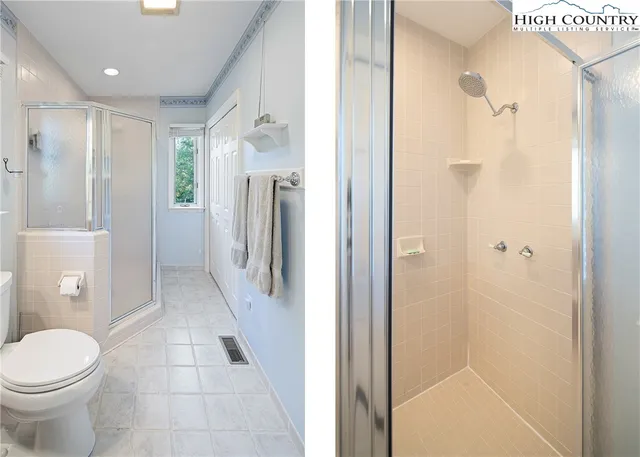 a bathroom with a granite countertop shower a toilet and a sink